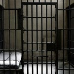 A cell of metal bars in a jail house representing le Prison rules in Roulette